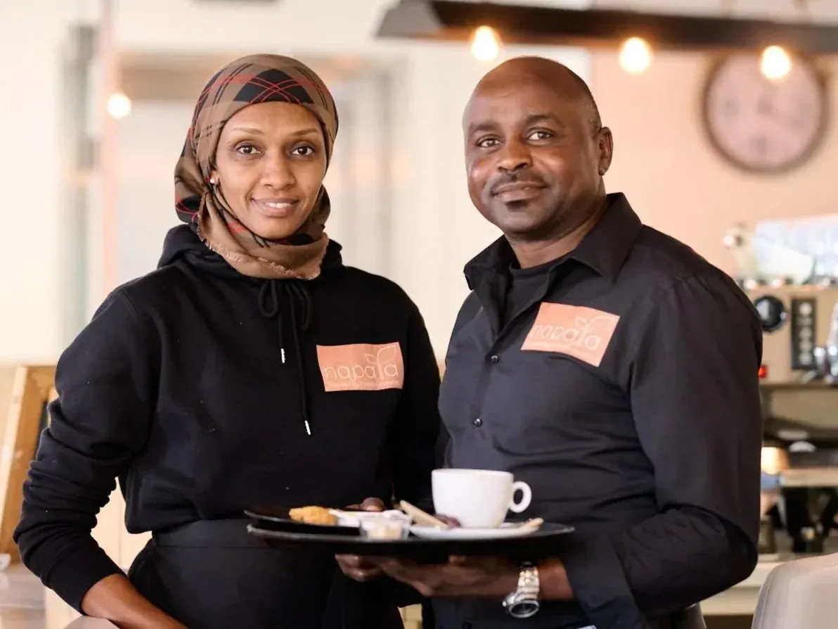 Ranya and Abdelrahman serving coffee and food at Napata