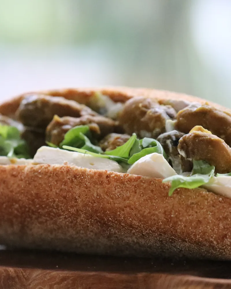 A pitta filled with aubergine, herbs and tahini dressing