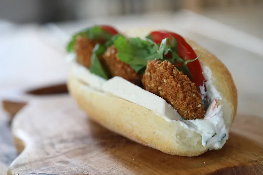 A falafel sub with white cheese and rocket