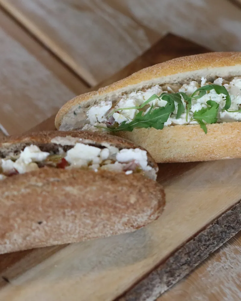 A sub of fava beans, feta and rocket in wholemeal bread