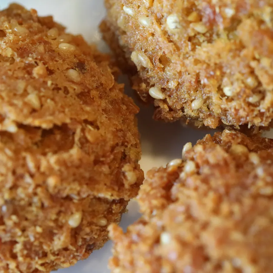 Macro detail of the crisp crust on freshly fried falafel