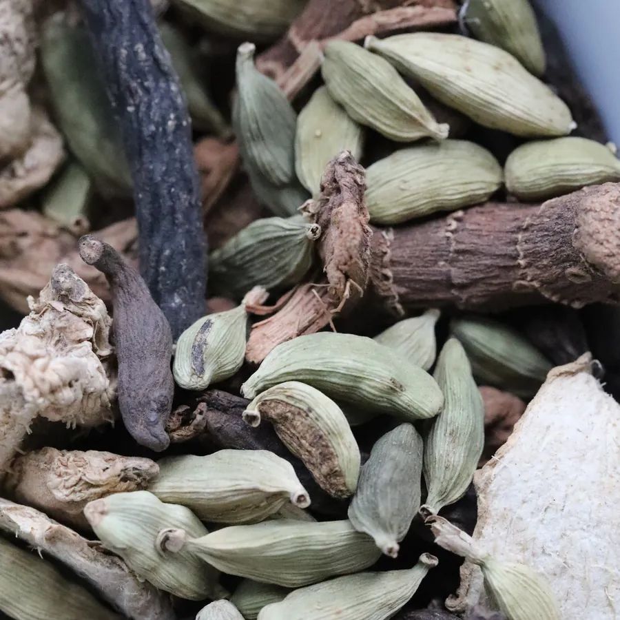 Whole cardamom pods and dried spices used in the Napata kitchen