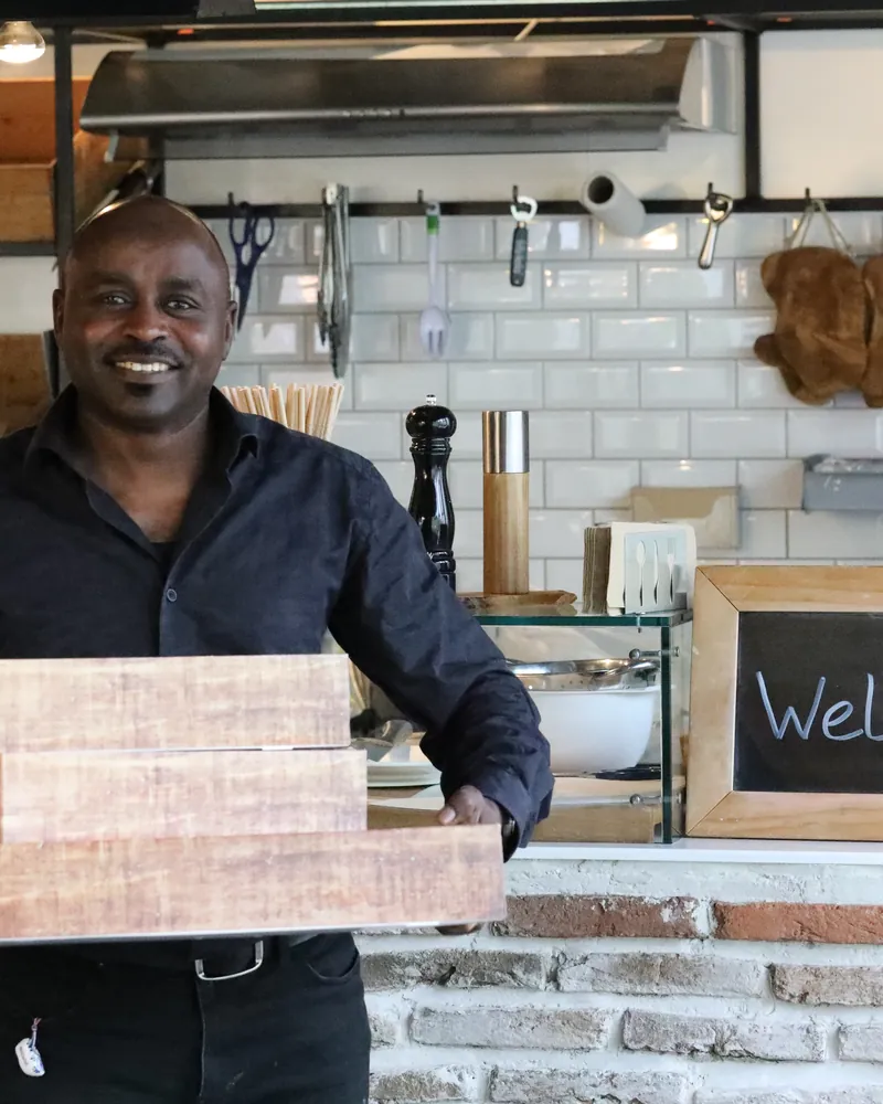 A member of the Napata team with a catering order ready to go
